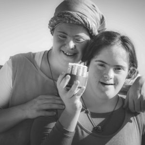 two girls with lip balm assortment. black and white photo